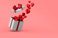 White box with red bow and hearts on pink background. Isolated 3D illustration Royalty Free Stock Photo
