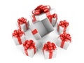 White boxes with red ribbons arranged in a circle, in the center Royalty Free Stock Photo