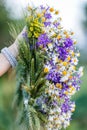 White bracelet on hand and wreath Royalty Free Stock Photo