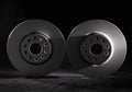 White brake discs on a black background. Efficient braking, safety. Close-up Royalty Free Stock Photo