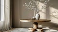 White branches in paunchy vase on round old wooden brown table against empty gray wall. Natural side lighting from window