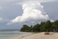 White and braun table and chair on the beach of a sandy beach. Royalty Free Stock Photo