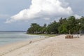 White and braun table and chair on the beach of a sandy beach. Royalty Free Stock Photo