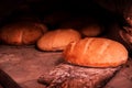 White bread is cooked in an old oven Royalty Free Stock Photo