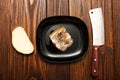 White bread loaf homemade hot and pork lard with interlayer a piece of rustic appetizing tasty in the oven on a cutting board on a Royalty Free Stock Photo