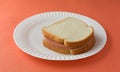 White bread sandwich on paper plate