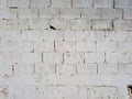 White brick background. Dirty texture of an old wall painted white. Architecture and construction Royalty Free Stock Photo