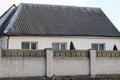 White brick fence wall in front of a private house Royalty Free Stock Photo