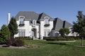 White brick home with arched entry