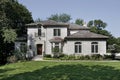 White brick home with cedar shake roof Royalty Free Stock Photo