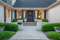 a white brick house with a black door and grey shutters Royalty Free Stock Photo