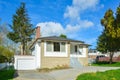 White brick house with concrete driveway on blue sky background Royalty Free Stock Photo