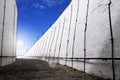 White brick wall against blue sky