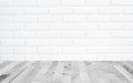 White brick wall background with perspective light wood, slightly blurry wood foreground Royalty Free Stock Photo