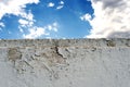 White Brick Wall with Cloudy Blue Sky Royalty Free Stock Photo