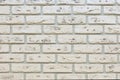 White brick wall with grain rough shabby porous stone. Decorative wall decoration, backdrop texture background. White limestone Royalty Free Stock Photo