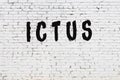 Word ictus painted on white brick wall Royalty Free Stock Photo