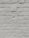 the white brick wall of an old building with narrow bricks Royalty Free Stock Photo