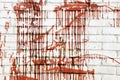 The red liquid on the white brick wall is a beautiful decor Royalty Free Stock Photo
