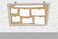 White brick wall with papers on a big board Royalty Free Stock Photo