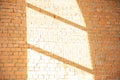 White brick wall with shadow and rays of light from the window Royalty Free Stock Photo