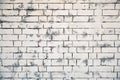 White brick wall texture. Background of brickwork painted in white with grey paint. Texture old bricks are painted Royalty Free Stock Photo