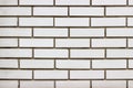 White brick wall texture with dark spaces Royalty Free Stock Photo