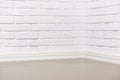 White brick wall with tiled floor, abstract background photo Royalty Free Stock Photo