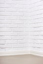 White brick wall with tiled floor, abstract background photo Royalty Free Stock Photo