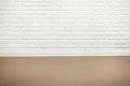 White brick wall with tiled floor, abstract background photo Royalty Free Stock Photo