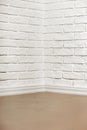 White brick wall with tiled floor and corner, abstract background photo Royalty Free Stock Photo