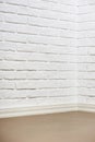 White brick wall with tiled floor and corner, abstract background photo Royalty Free Stock Photo