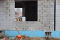 White brick wall of unfinished house with a large empty window Royalty Free Stock Photo