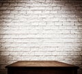 White brick wall and wooden table