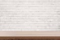 White brick wall and wooden table with copy space, display montage for product