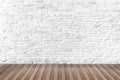 White brick walls that are not plastered background and wooden floor. Hardwood floor texture of empty brick basement wall Royalty Free Stock Photo