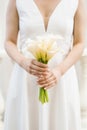 White bridal bouquet of calla lilies in the hands of the bride Royalty Free Stock Photo