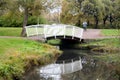 White bridge and pond in the city park Haanoja. Kouvola, Finland