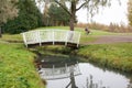 White bridge and pond in the city park Haanoja. Kouvola, Finland