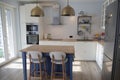 White kitchen with blue island