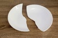 White broken plate on the table Royalty Free Stock Photo