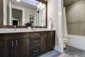 White and brown bathroom boasts a nook filled with double vanity Royalty Free Stock Photo