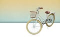 white and brown bicycle on white floor background, yellow and green cement wall, object, transpot, decor, fashion, banner, copy Royalty Free Stock Photo