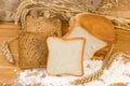 White and brown bread for toasting with ears and flour