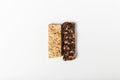 White and brown cereal bars. healthy sweet granola bar. white background. top view with copy space Royalty Free Stock Photo