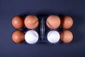 White and brown chicken eggs in a plastic package. Royalty Free Stock Photo