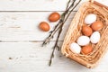 White and brown eggs in the basket on the table. Easter Royalty Free Stock Photo