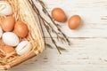 White and brown eggs in the basket on the table. Easter Royalty Free Stock Photo