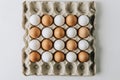 white and brown eggs laying in egg carton Royalty Free Stock Photo