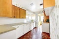 White and brown kitchen interior with tile and floral patterned Royalty Free Stock Photo